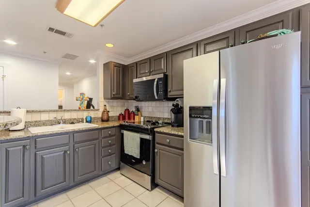 a kitchen with a refrigerator a sink and dishwasher