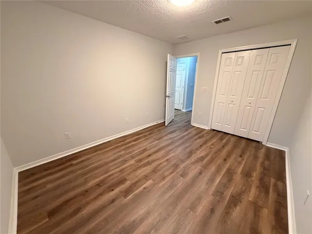 wooden floor in a hall with an entryway