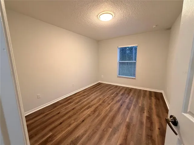 a view of a door and chair in the room