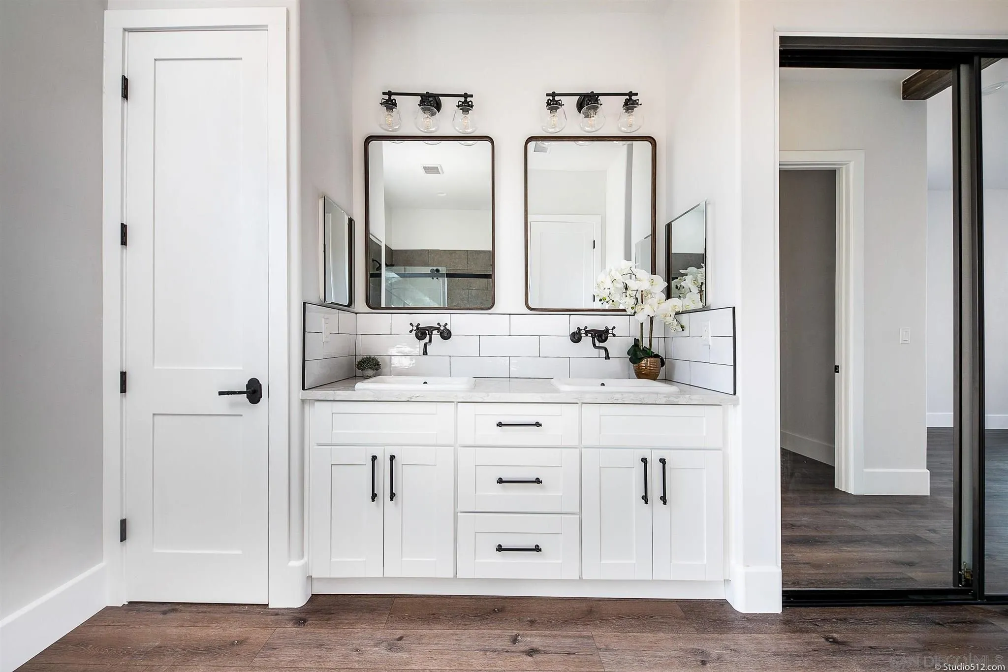 28661 Double K Road Valley Center, CA 92082 - Photo 18 of 34 a bathroom with a double vanity sink and a mirror