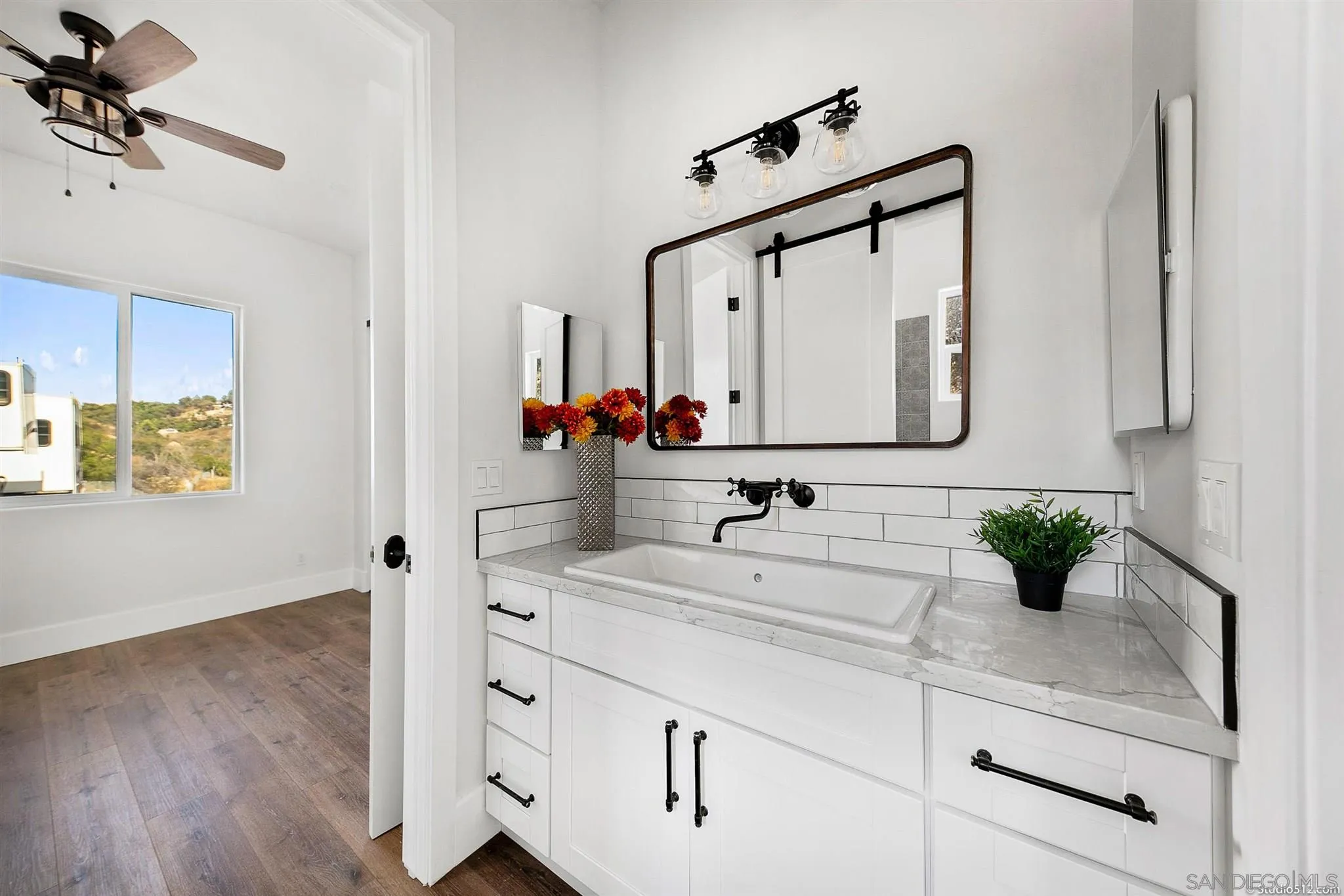 28661 Double K Road Valley Center, CA 92082 - Photo 21 of 34 a bathroom with a sink and a mirror