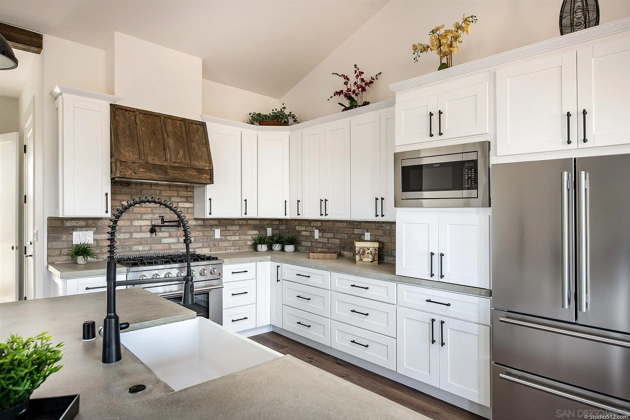 28661 Double K Road Valley Center, CA 92082 - Photo 3 of 34 a kitchen with stainless steel appliances granite countertop a refrigerator sink and stove