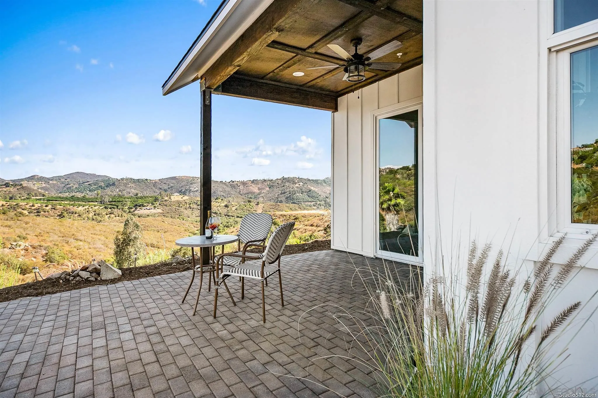 28661 Double K Road Valley Center, CA 92082 - Photo 31 of 34 a dining room with furniture and a floor to ceiling window