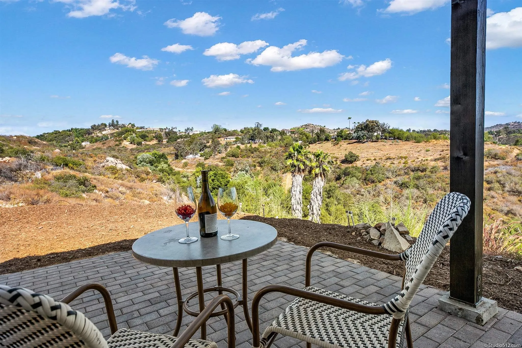28661 Double K Road Valley Center, CA 92082 - Photo 32 of 34 a view of a balcony with chair and table