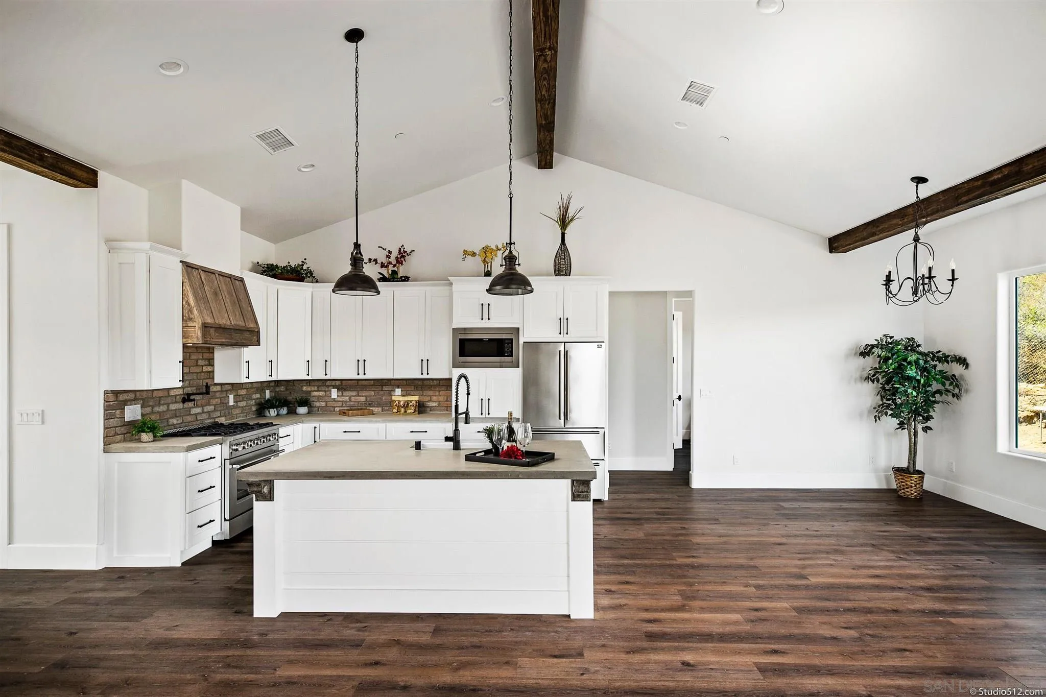 28661 Double K Road Valley Center, CA 92082 - Photo 4 of 34 a view of kitchen with stainless steel appliances kitchen island sink stove and refrigerator