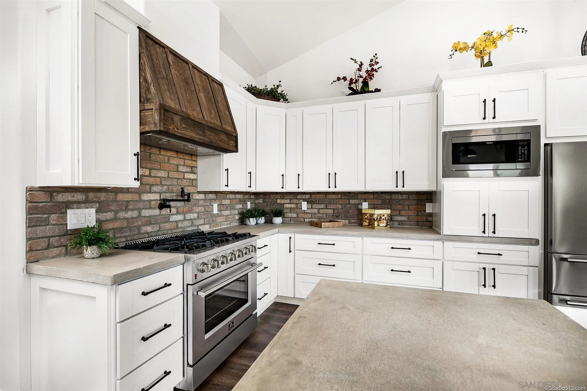 28661 Double K Road Valley Center, CA 92082 - Photo 5 of 34 a kitchen with cabinets stainless steel appliances and a counter space