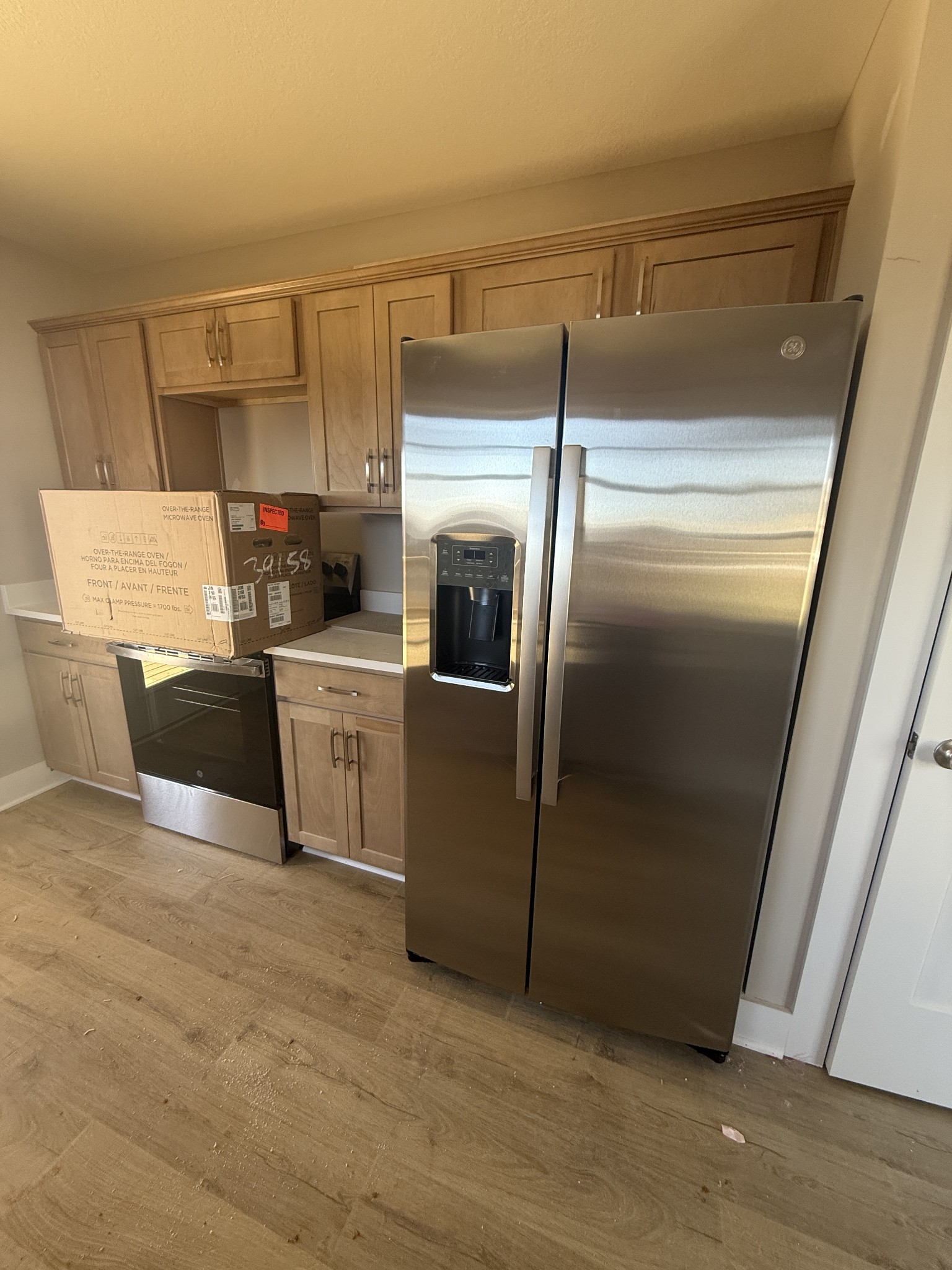 21 Echo Ridge Oak Grove, KY 42240 - Photo 48 of 51 a kitchen with a refrigerator and white cabinets