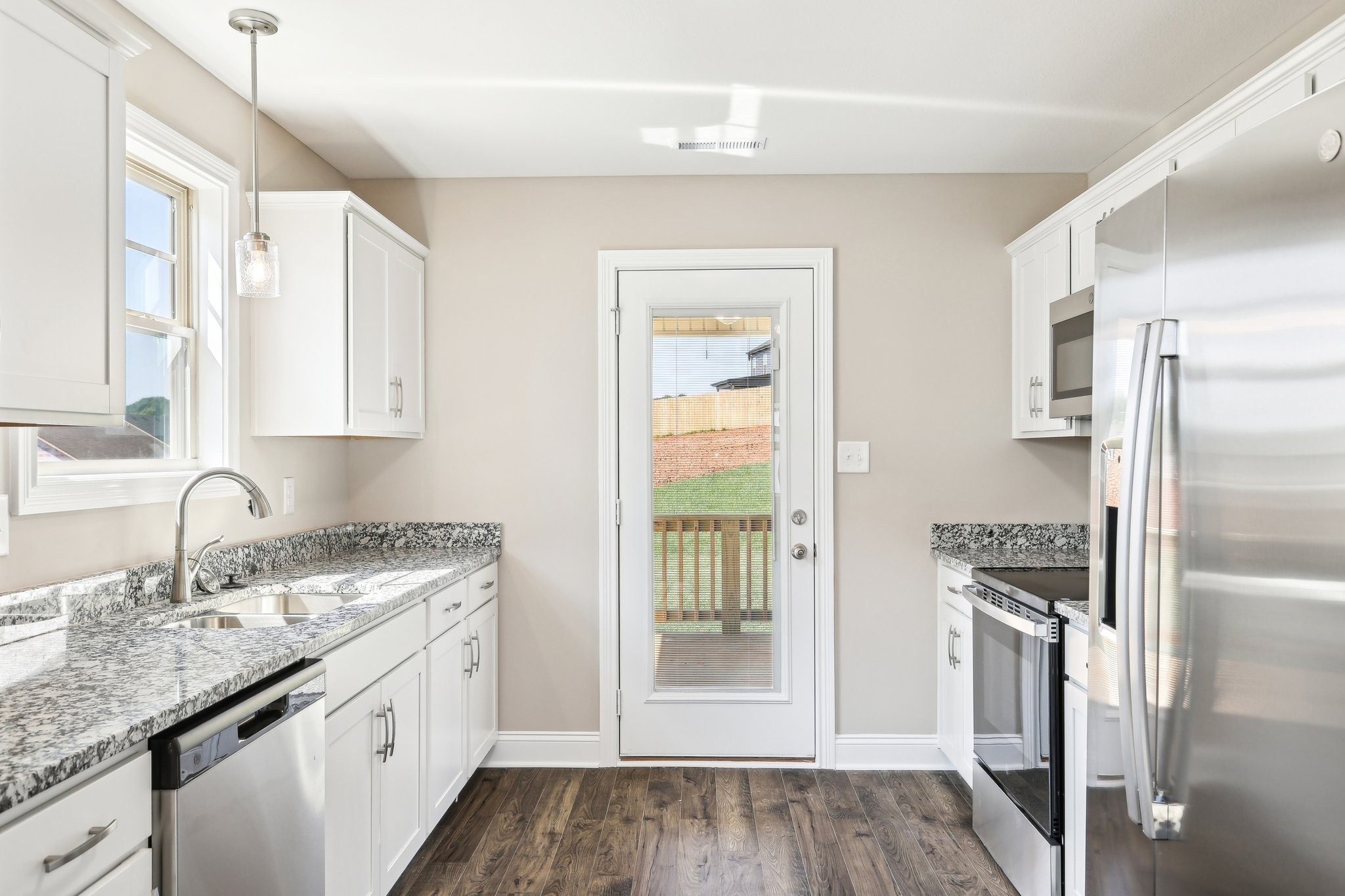 21 Echo Ridge Oak Grove, KY 42240 - Photo 8 of 51 a kitchen with granite countertop a refrigerator and a sink