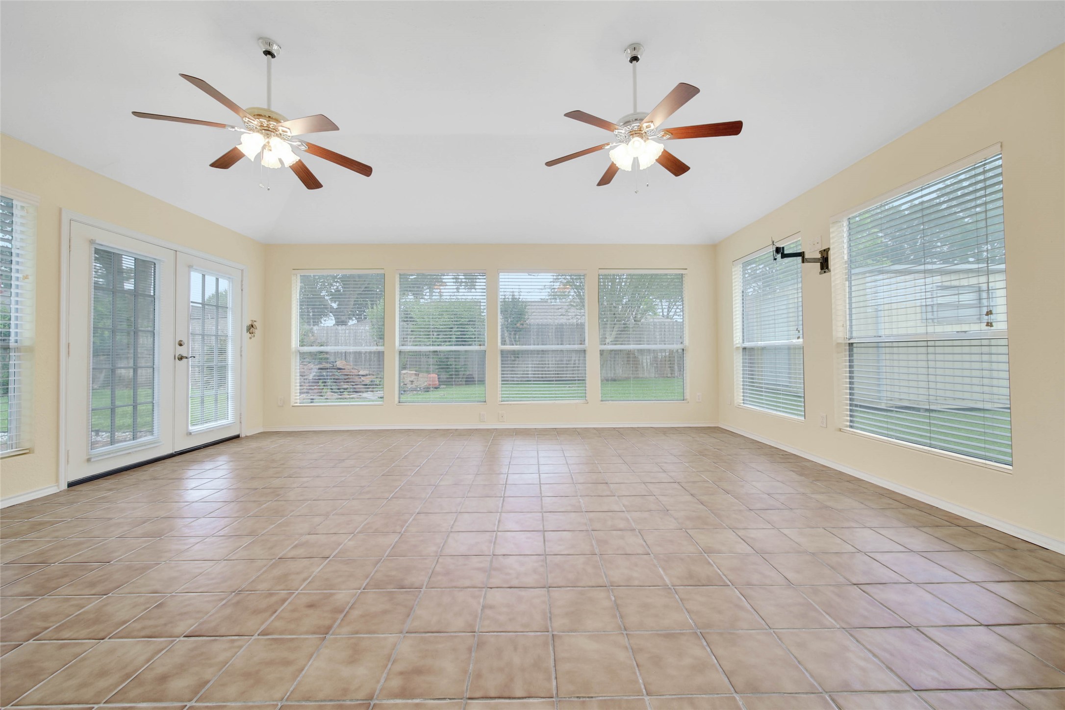 5010 Cupids Bower Court Spring, TX 77388 - Photo 13 of 40 a view of an empty room with a ceiling fan and window