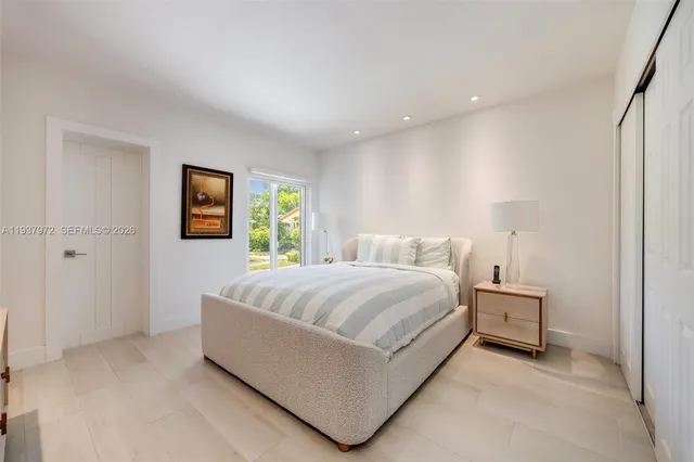 a bedroom with a bed and a couch