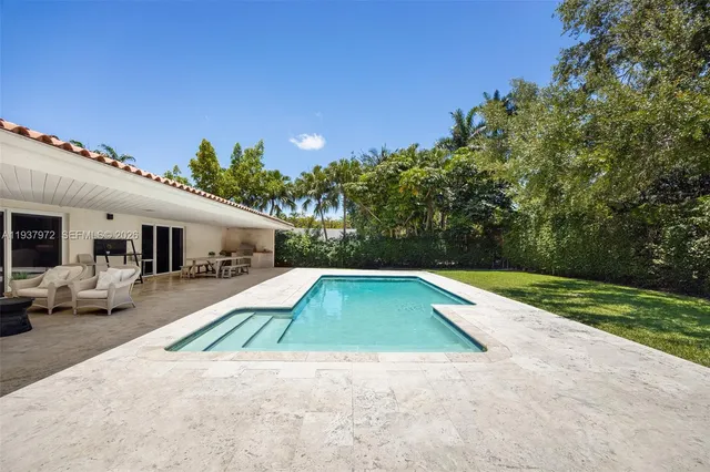 a view of outdoor space and swimming pool
