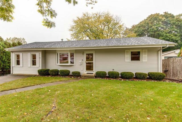 361 Cherry Valley Road Vernon Hills, IL 60061 - Photo 1 of 15 a backyard of a house with yard and outdoor seating