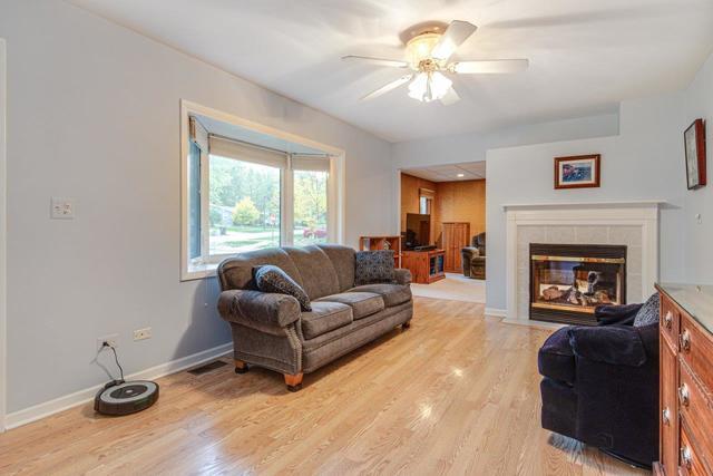 361 Cherry Valley Road Vernon Hills, IL 60061 - Photo 6 of 15 a living room with furniture and a fireplace