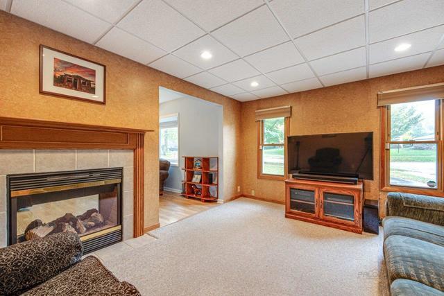 361 Cherry Valley Road Vernon Hills, IL 60061 - Photo 7 of 15 a living room with furniture and a flat screen tv