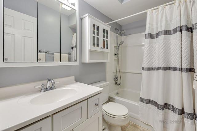 361 Cherry Valley Road Vernon Hills, IL 60061 - Photo 8 of 15 a bathroom with a sink toilet and shower