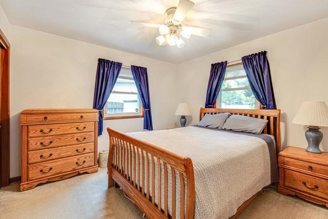 361 Cherry Valley Road Vernon Hills, IL 60061 - Photo 9 of 15 a bedroom with a bed and a baby crib