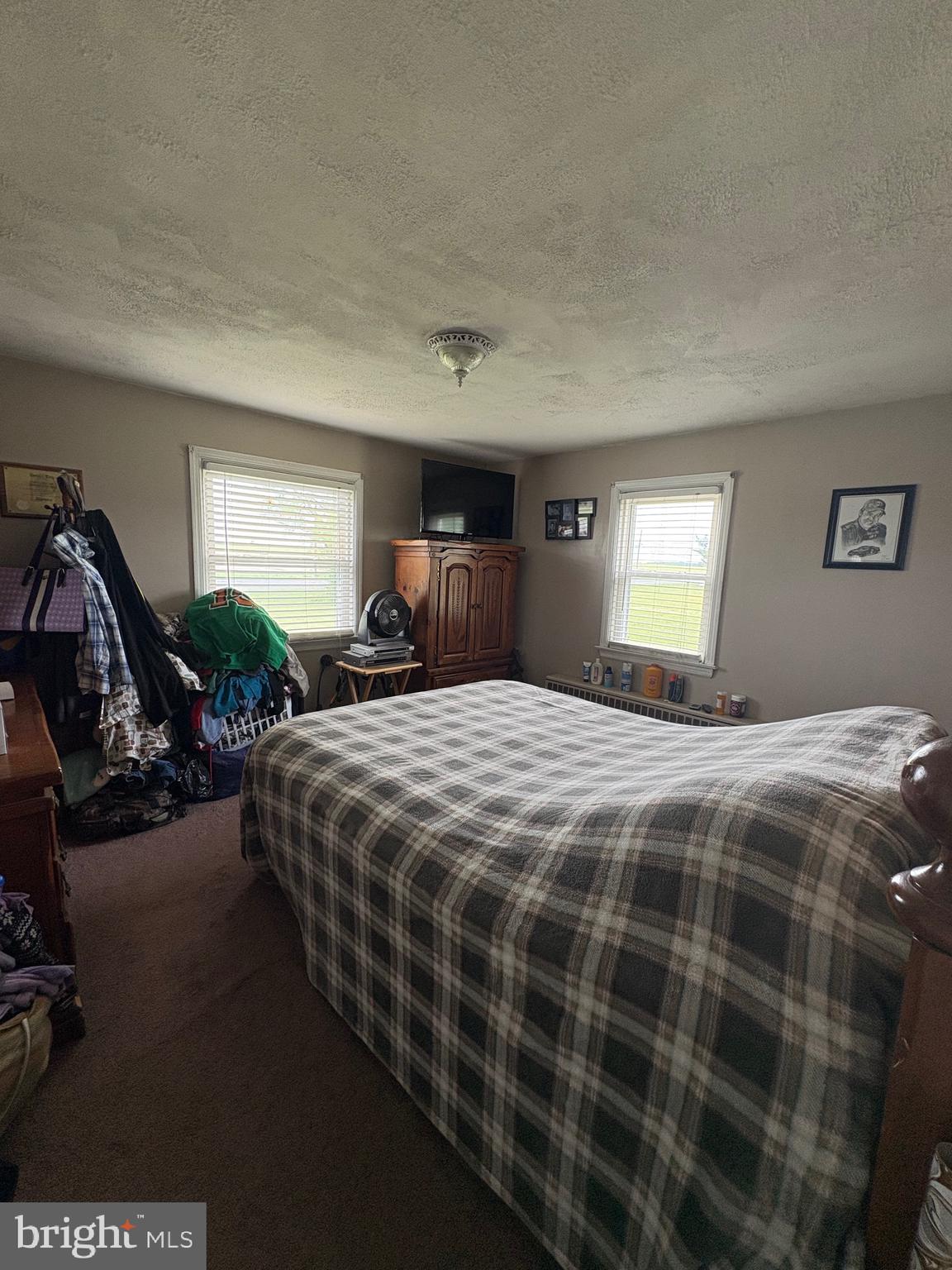 492 Highway 40 Elmer, NJ 08318 - Photo 13 of 30 a bedroom with a bed and a window