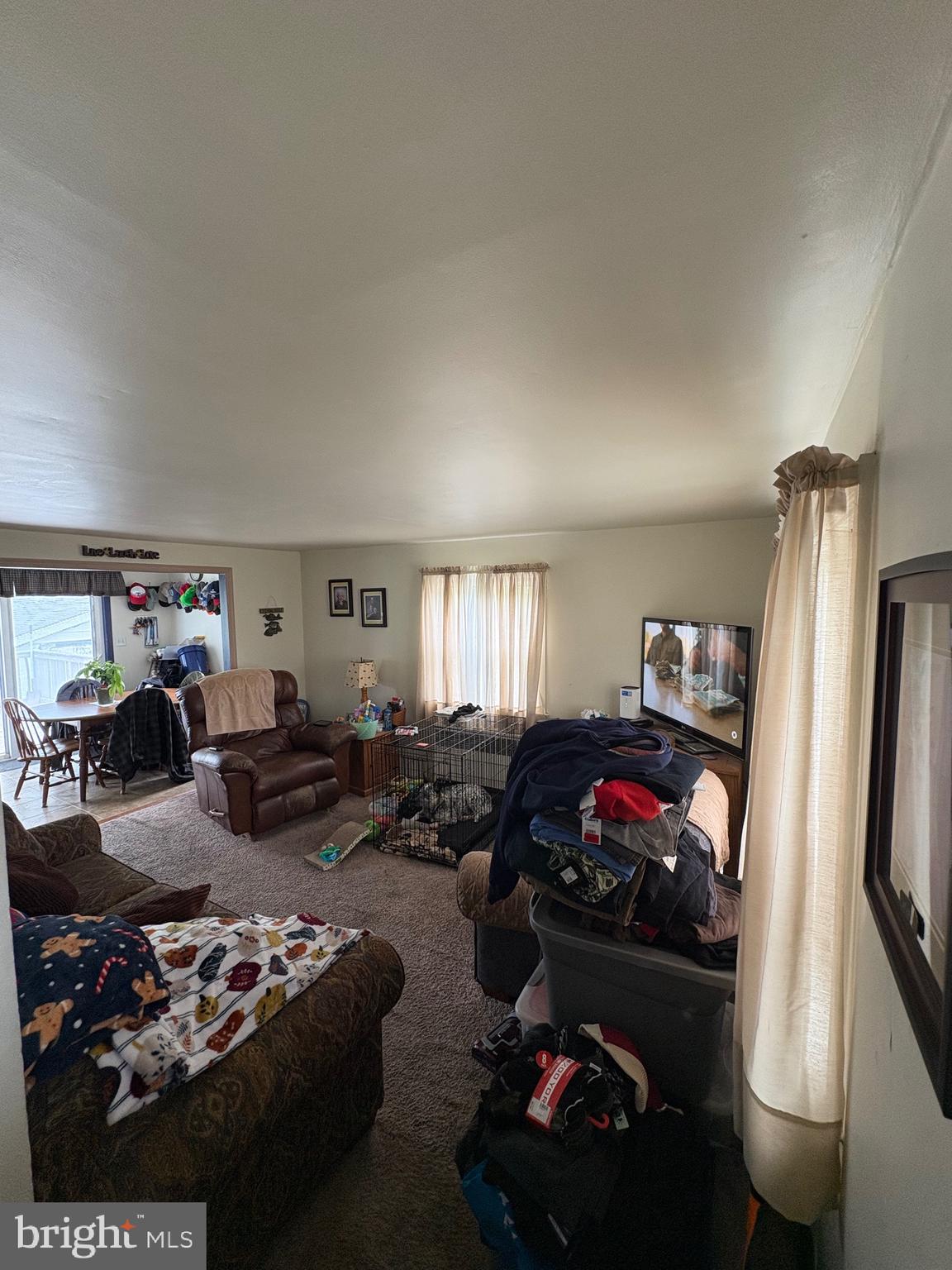 492 Highway 40 Elmer, NJ 08318 - Photo 19 of 30 a living room with furniture window and a flat screen tv