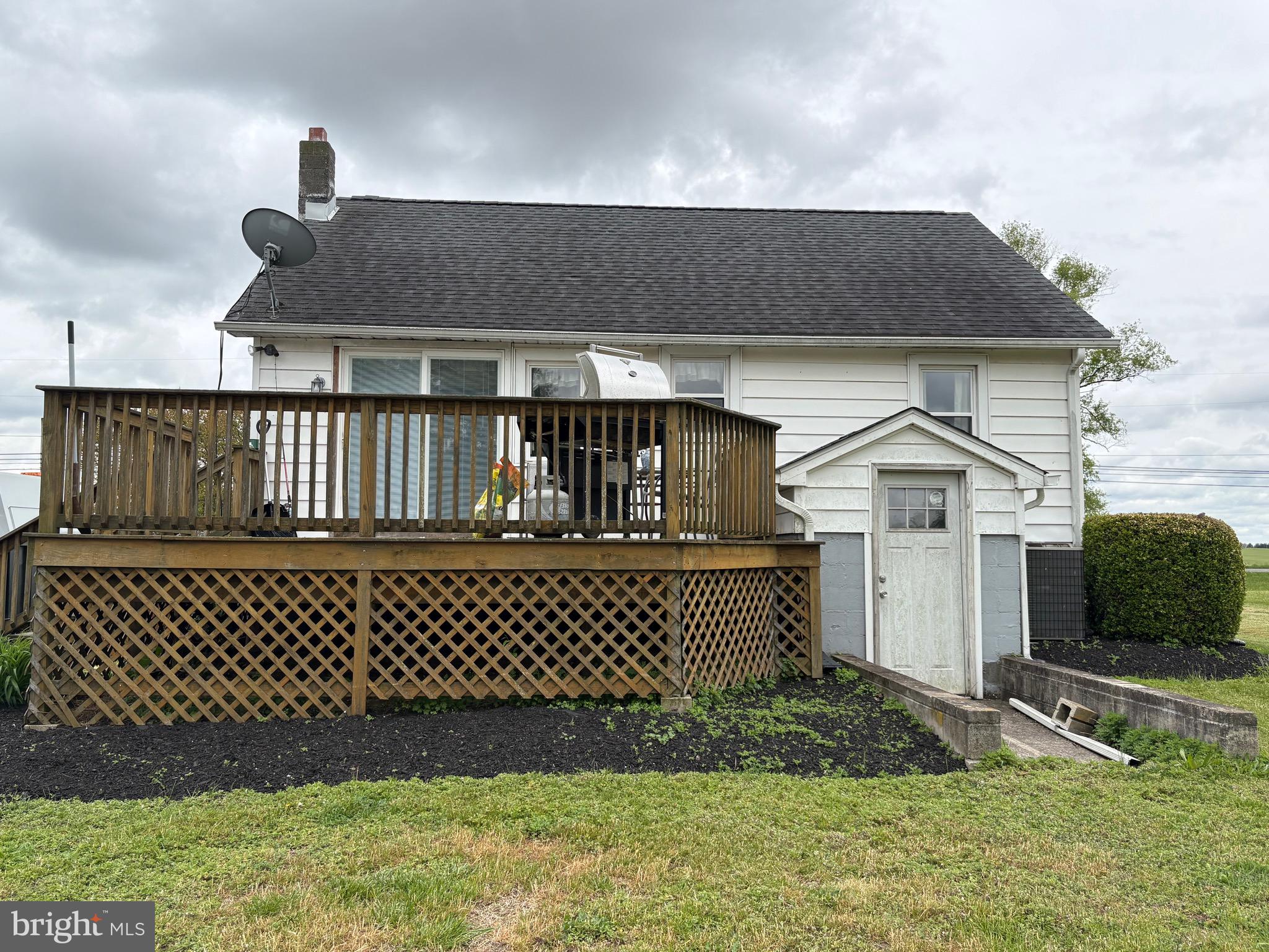 492 Highway 40 Elmer, NJ 08318 - Photo 5 of 30 a front view of a house with a garden