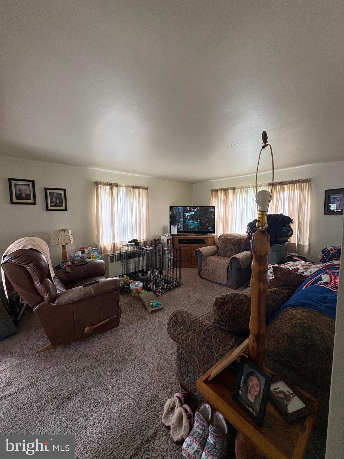 492 Highway 40 Elmer, NJ 08318 - Photo 9 of 30 a living room with furniture a ceiling fan and a window