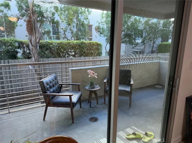 a room with pool table and windows