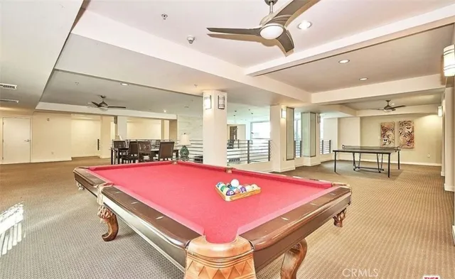 a living room with a fireplace and a flat screen tv