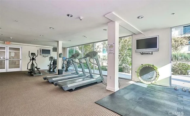 a view of a house with backyard porch and sitting area