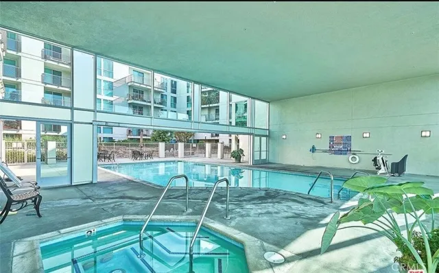 a bathroom with a shower and a glass door