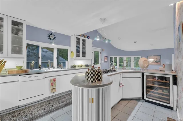 a kitchen with a sink stove and cabinets