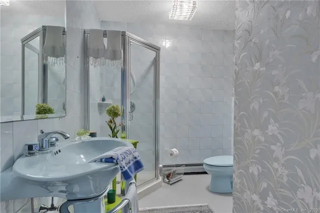 a bed room with a bed and a painting