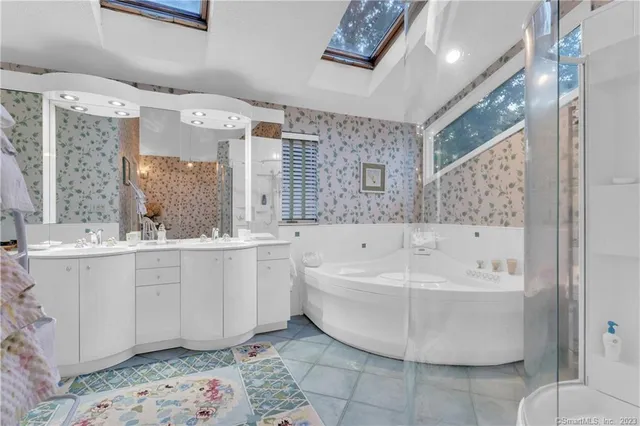 a bedroom with furniture and a book shelf