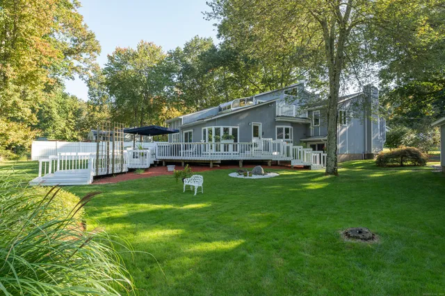 a yard with lots of green space and trees