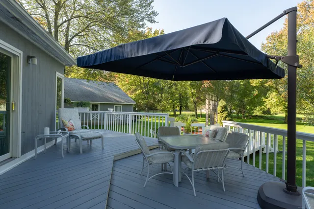 a view of backyard and deck