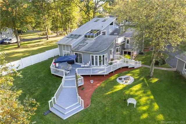 an aerial view of a house with swimming pool garden and patio