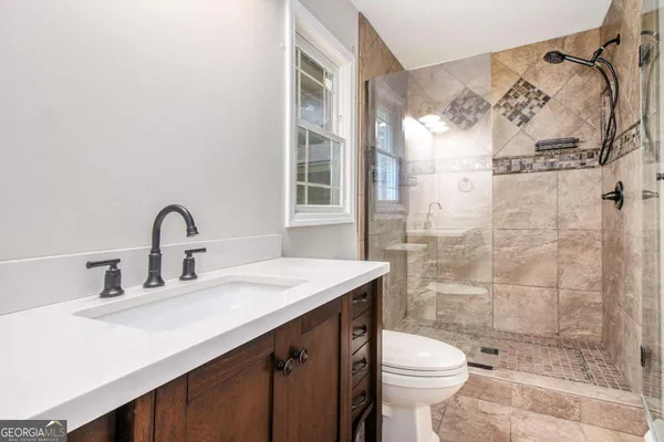 a bathroom with a sink and a toilet