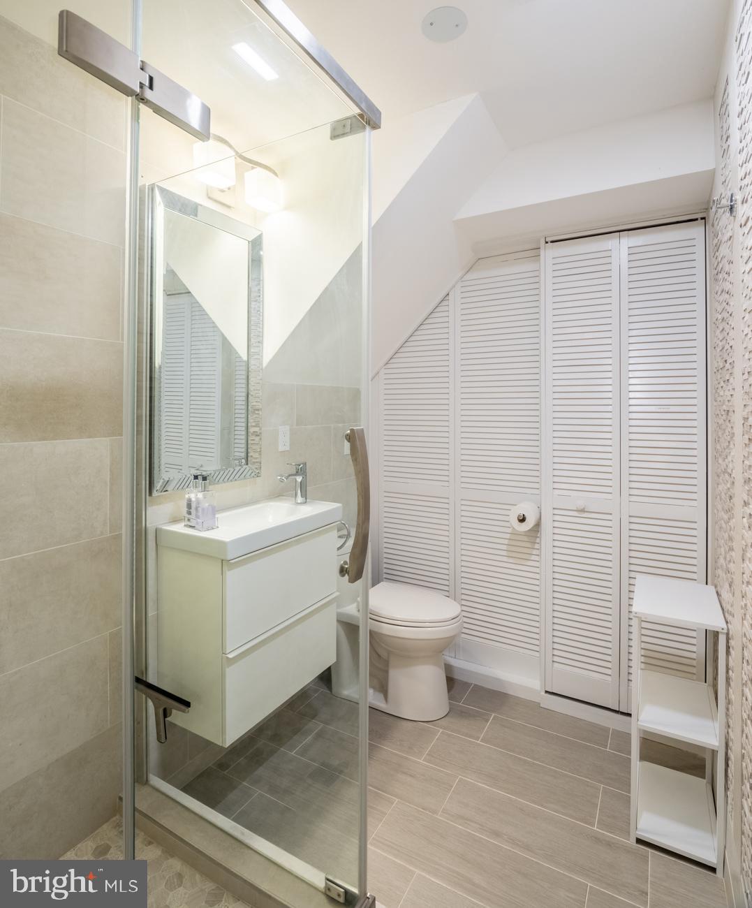 1407 33rd Street Northwest Washington, DC 20007 - Photo 14 of 17 a bathroom with a sink a toilet and shower