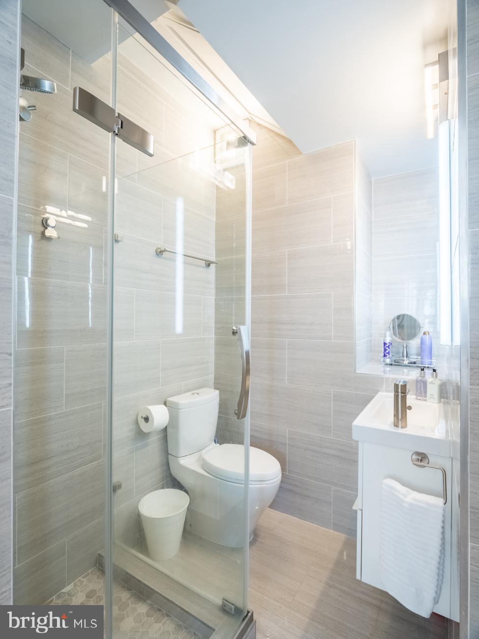1407 33rd Street Northwest Washington, DC 20007 - Photo 7 of 17 a bathroom with a toilet sink and shower
