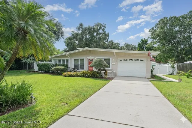 a view of house with outdoor space and yard