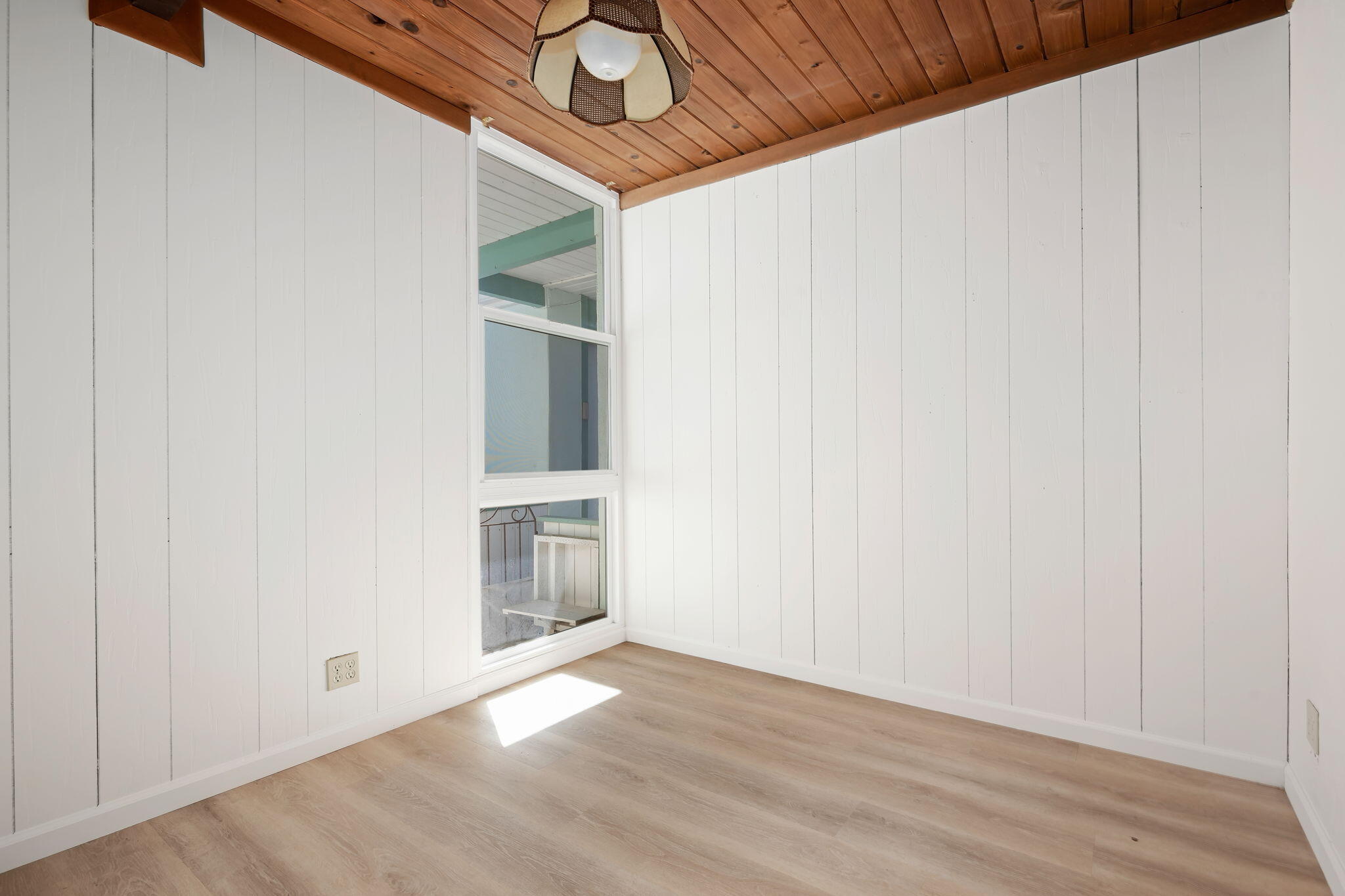 122 Kinman Avenue Goleta, CA 93117 - Photo 19 of 20 a view of an empty room with a fireplace and wooden floor