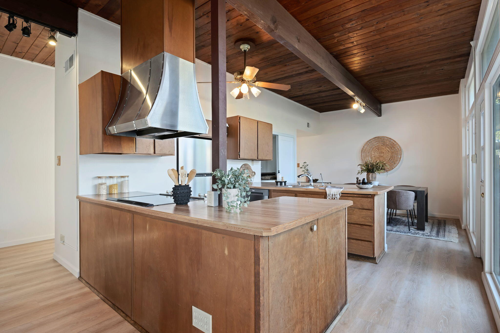 122 Kinman Avenue Goleta, CA 93117 - Photo 7 of 20 a kitchen with stainless steel appliances granite countertop a sink a stove and a wooden floors