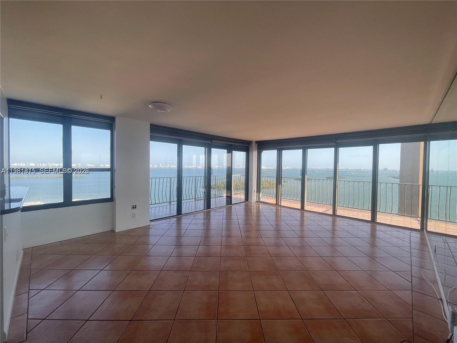 780 Northeast 69th Street, Unit 2201 Miami, FL 33138 - Photo 4 of 15 a view of an empty room with a window