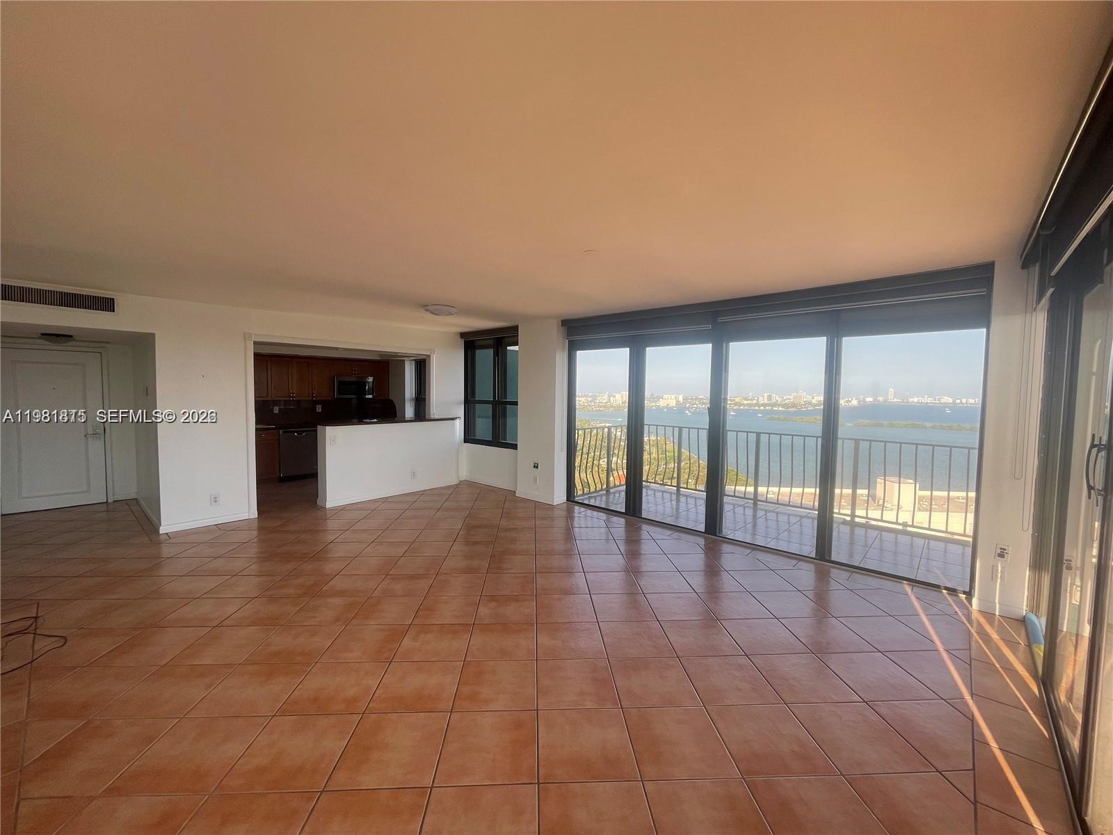 780 Northeast 69th Street, Unit 2201 Miami, FL 33138 - Photo 5 of 15 a view of an empty room and window