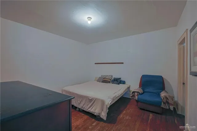 a bedroom with a bed and a chair