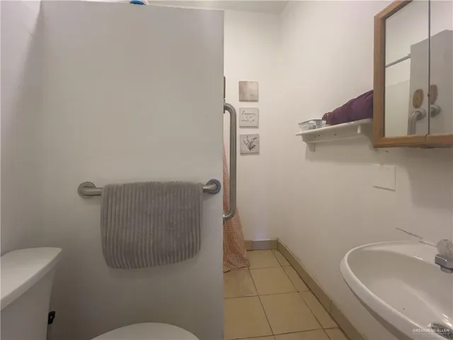 a bathroom with a sink and toilet