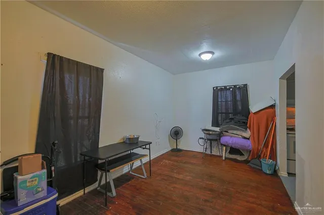 a room with furniture and wooden floor