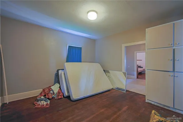 a view of a refrigerator in kitchen and wooden floor