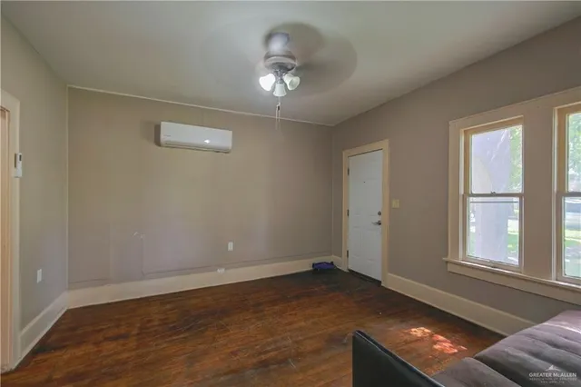 a room with window and ceiling fan