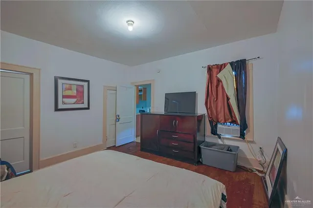 a bedroom with a bed and a closet