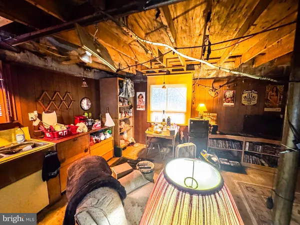 a outdoor living space with furniture and a flat screen tv