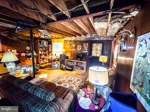 a living room with lots of furniture and a chandelier